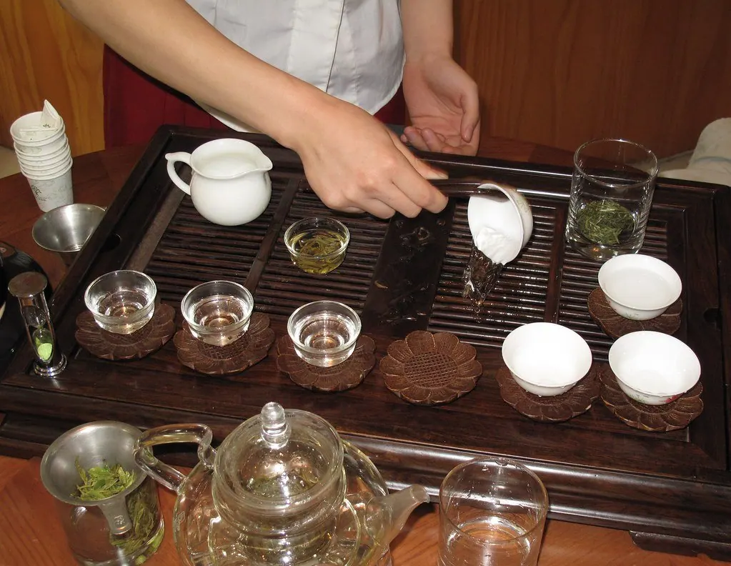 Pouring tea in warm morning light — a quiet everyday ritual