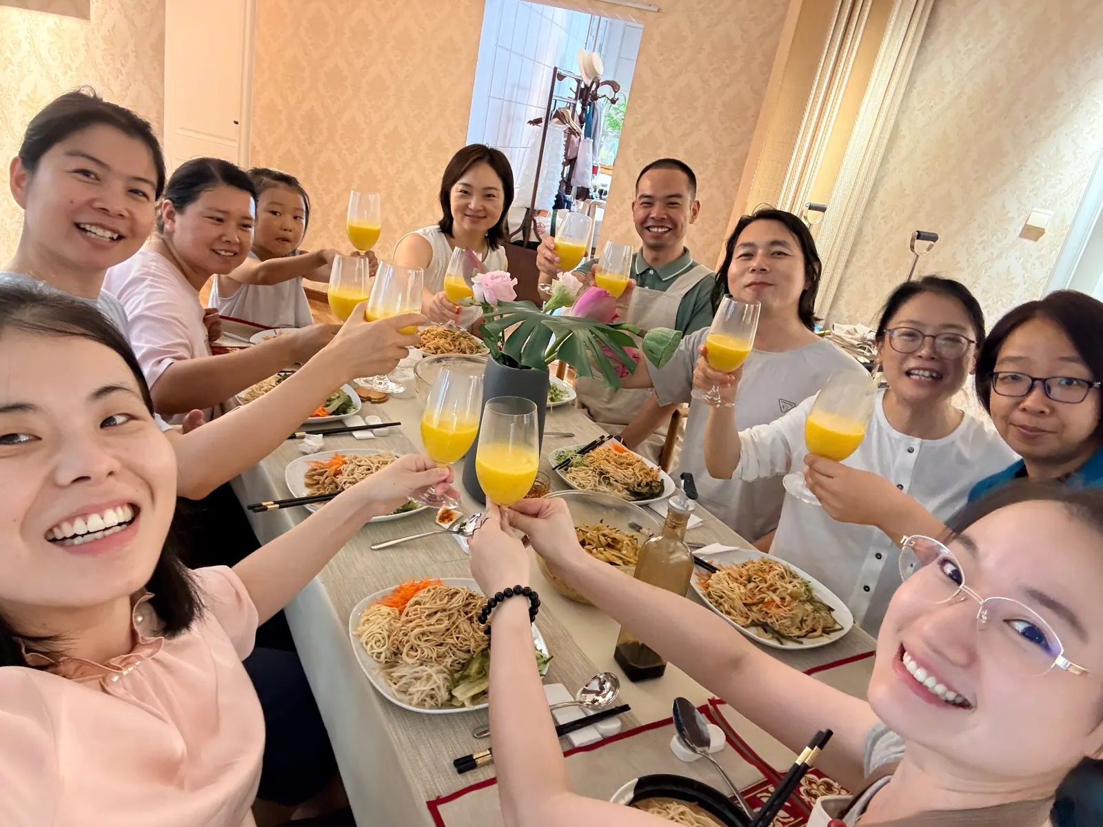 Friends sharing a meal and laughter around the table